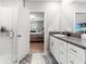 Bathroom with shower and access to the bedroom at 1911 Fan Aloe Way, Ruskin, FL 33570