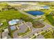 Community overview featuring pool, playground, and homes at 1911 Fan Aloe Way, Ruskin, FL 33570