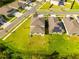 Aerial view of houses with community pool and basketball court at 1911 Fan Aloe Way, Ruskin, FL 33570