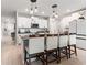 Modern kitchen with white cabinets, granite countertops, and stainless steel appliances at 1911 Fan Aloe Way, Ruskin, FL 33570