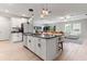 Spacious kitchen island with granite countertop and white cabinets at 1911 Fan Aloe Way, Ruskin, FL 33570