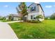 Two-story house with gray exterior and a dark garage door at 1911 Fan Aloe Way, Ruskin, FL 33570
