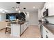 Modern kitchen with island, granite countertops, and stainless steel appliances at 1911 Fan Aloe Way, Ruskin, FL 33570
