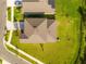 Aerial view of a house with a brown roof and solar panels at 1911 Fan Aloe Way, Ruskin, FL 33570
