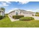 Exterior view of the house, showcasing the side and landscaping at 2839 Torrance Dr, Land O Lakes, FL 34638