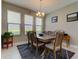 Charming dining room featuring a wooden table and six chairs at 29167 Perilli Pl, Wesley Chapel, FL 33543