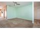 Spacious living room with neutral carpeting and walls at 332 Club Manor Dr # 10, Sun City Center, FL 33573