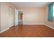 Bright bedroom with laminate flooring, closet and access to bathroom at 332 Club Manor Dr # 10, Sun City Center, FL 33573