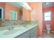 Double vanity bathroom with tile flooring at 332 Club Manor Dr # 10, Sun City Center, FL 33573