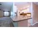 Kitchen features granite countertops and white cabinets at 332 Club Manor Dr # 10, Sun City Center, FL 33573
