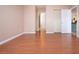 Bedroom with laminate wood flooring, and access to bathroom and closet at 332 Club Manor Dr # 10, Sun City Center, FL 33573
