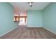 Open living room area with view into adjacent room at 332 Club Manor Dr # 10, Sun City Center, FL 33573