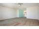 Spacious living room with neutral carpeting and a view into the dining area at 332 Club Manor Dr # 10, Sun City Center, FL 33573