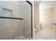 Clean bathroom with a shower, tiled walls, and neutral color scheme at 332 Club Manor Dr # 10, Sun City Center, FL 33573
