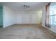 Spacious living area with carpeting and multiple closets at 332 Club Manor Dr # 10, Sun City Center, FL 33573