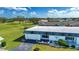 Single story home with a large yard and golf course views at 332 Club Manor Dr # 10, Sun City Center, FL 33573