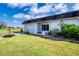 Single-story home with a carport and well-maintained lawn at 332 Club Manor Dr # 10, Sun City Center, FL 33573