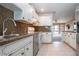 Open kitchen with granite countertops and stainless steel appliances at 332 Club Manor Dr # 10, Sun City Center, FL 33573