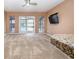 Living room with sliding glass doors to patio at 332 Club Manor Dr # 10, Sun City Center, FL 33573