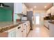 Kitchen with stainless steel appliances and back door at 332 Club Manor Dr # 10, Sun City Center, FL 33573