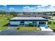 Single story home with a large yard and golf course views at 332 Club Manor Dr # 10, Sun City Center, FL 33573