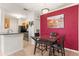 Modern dining area featuring stylish table with wine rack and colorful decor at 5000 Culbreath Key Way # 4-204, Tampa, FL 33611