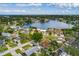 This aerial showcases the property's charming neighborhood with mature trees, and the beautiful waterfront nearby at 8950 3Rd N St, St Petersburg, FL 33702