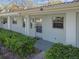 Exterior view of light-blue building with landscaping and walkway at 11200 102Nd Ave # 136, Seminole, FL 33778