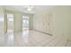 Bedroom with tile floors, large closet, and access to a sunroom at 11200 102Nd Ave # 136, Seminole, FL 33778