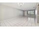 Living room with tiled floors, a window, and a chandelier at 11200 102Nd Ave # 136, Seminole, FL 33778