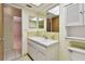 Bathroom with double vanity and a view of bedroom at 11200 102Nd Ave # 136, Seminole, FL 33778