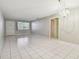 Bright living room featuring tile floors and a chandelier at 11200 102Nd Ave # 136, Seminole, FL 33778