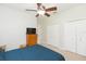 Bedroom with double closets and ceiling fan at 15802 Sorawater Dr, Lithia, FL 33547