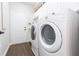 Bright laundry room with washer, dryer, and extra storage at 15802 Sorawater Dr, Lithia, FL 33547