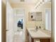 Bathroom with sink, toilet and a view of a home office at 2700 Hawk Roost Ct, Holiday, FL 34691