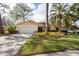 House exterior showcasing the front facade, driveway, and landscaping at 3006 Bolt Dr, Palm Harbor, FL 34685