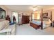 Spacious bedroom with a large bed, ample closet space, and seating area at 3006 Bolt Dr, Palm Harbor, FL 34685