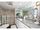 Elegant bathroom with granite countertops, double sinks, and a walk-in shower at 3006 Bolt Dr, Palm Harbor, FL 34685