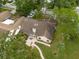 Aerial view showing home's roofline, patio, and landscaping at 3006 Bolt Dr, Palm Harbor, FL 34685
