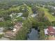 Wide aerial view of the house and neighborhood at 3006 Bolt Dr, Palm Harbor, FL 34685