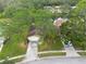 Aerial view of the house, driveway and surrounding neighborhood at 3006 Bolt Dr, Palm Harbor, FL 34685