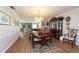 Bright dining room with hardwood floors and a beautiful china cabinet at 3006 Bolt Dr, Palm Harbor, FL 34685