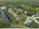 Aerial view of property and surrounding golf course community at 3006 Bolt Dr, Palm Harbor, FL 34685
