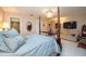 Comfortable bedroom with a large bed, sitting area, and en-suite bathroom at 3006 Bolt Dr, Palm Harbor, FL 34685