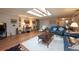 Open living room with hardwood floors, comfortable seating, and a cozy atmosphere at 3006 Bolt Dr, Palm Harbor, FL 34685