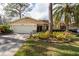 Single-story home with attached garage and landscaping at 3006 Bolt Dr, Palm Harbor, FL 34685