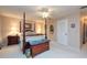Bright bedroom featuring a post bed and ample floor space at 3006 Bolt Dr, Palm Harbor, FL 34685