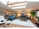 Bright living room with hardwood floors and a skylight, offering a comfortable and airy feel at 3006 Bolt Dr, Palm Harbor, FL 34685