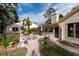 Brick paved patio with seating and fountain at 3006 Bolt Dr, Palm Harbor, FL 34685