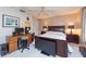 Serene bedroom with a queen-size bed and a built-in work area at 3006 Bolt Dr, Palm Harbor, FL 34685